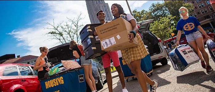 Plenty of people are on hand to help incoming students move in to the Pittsburgh campus