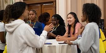 Provost Academy students mingle at a reception